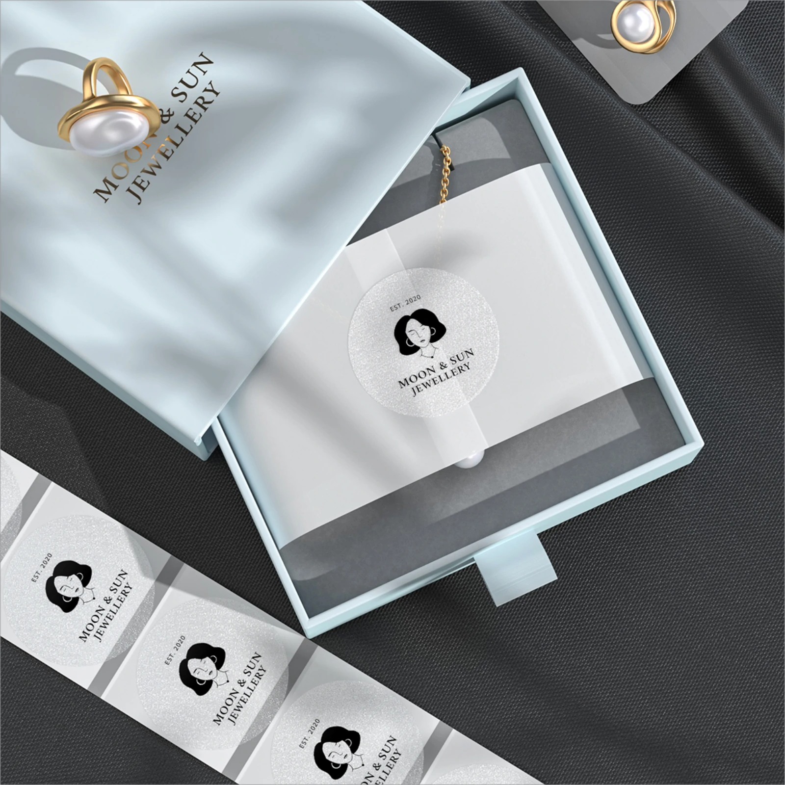 Silver 2-inch label printer paper by MUNBYN CA, shown in a roll with printed labels ready for use.