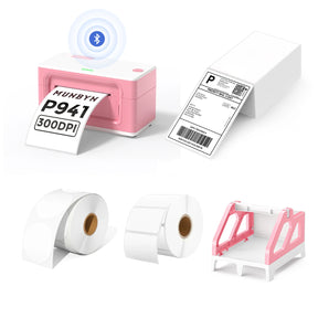 MUNBYN P941B pink Bluetooth Thermal Label Printer Kit includes a pink Bluetooth label printer, a pink label roll holder, two rolls of blank labels, and a stack of shipping labels.