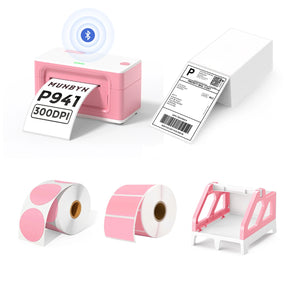 MUNBYN P941B pink Bluetooth Thermal Label Printer Kit includes a pink Bluetooth label printer, a pink label roll holder, two rolls of pink labels, and a stack of shipping labels.
